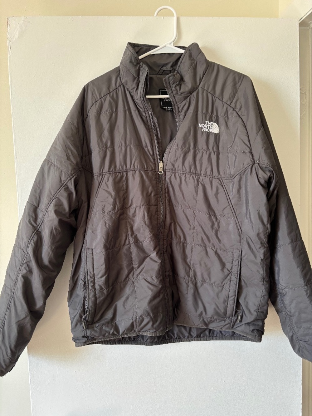 grey The North Face insulated puffer jacket.